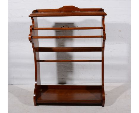 An Edwardian walnut towel rail, open shelf with three quarter gallery over two rails, platform base, width 75cm.