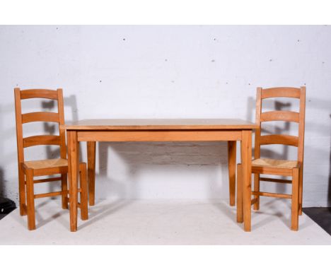 Modern oak dining table, rectangular top, square tapering legs, 137 x 75cm and a set four oak ladder-back dining chairs, with