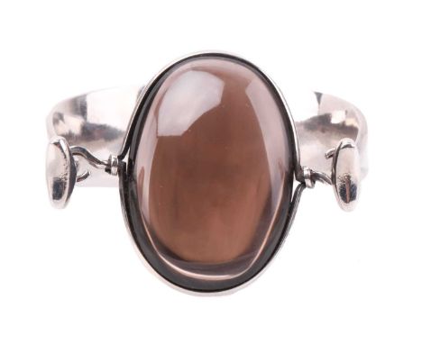 Georg Jensen - 'Arm Ring' with smokey quartz, a tension clamp opening bangle with an oval panel of smokey quartz set in a kni