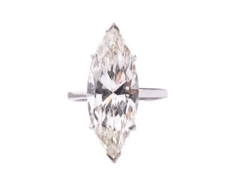 A large diamond solitaire ring, featuring a marquise-cut diamond of 7.09ct, approximately measures 24.2 x 9.6 x 5.6 mm, mount