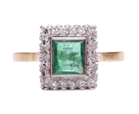 An emerald and diamond halo ring, featuring a rectangular step-cut emerald of bright green colour, approximately measures 5.7