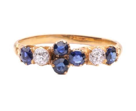 A late Victorian half hoop sapphire and diamond ring; comprising two oval cut sapphires, two old brilliant cut diamonds and a