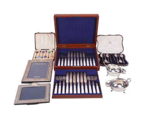 A pair of 1930s silver sauce boats, a set of mother of pearl handled fruit knives and forks, a cased set of tea spoons and su