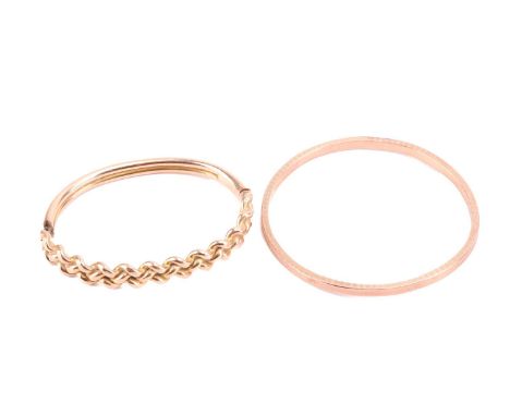 Two Edwardian gold bracelets; to include a hollow closed bangle in 9ct rose gold, embellished with engine-turned patterns, Ch