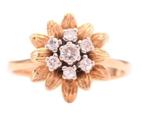 A diamond flower ring, set with a central cluster of round brilliant cut diamonds with a total estimated weight of 0.35ct, to