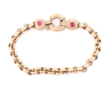 A 9ct gold and ruby set bracelet; the cable links with rectangular terminals set with single circular cabochon and caibré cut