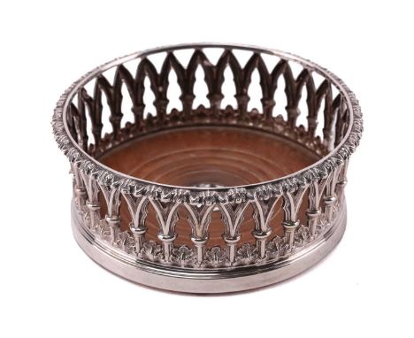 An early Victorian "Gothic Revival" circular silver bottle coaster, Sheffield 1843, by Henry Wilkinson &amp; Co, with cast an