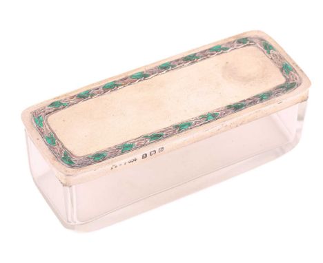 A Liberty and Co. glass dressing table box with silver cover, Birmingham 1923, the silver cover with green enamel and repouss