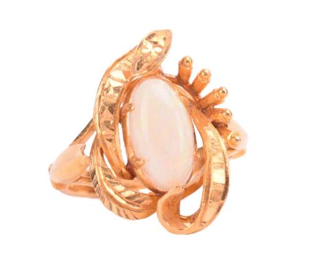 An opal ring, set with white opal in a foliate asymmetric mount, the shank stamped 22K, ring size I. Total weight 5.2g.