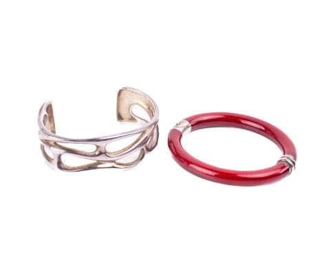 Tiffany &amp; Co. - two bracelets; the first hinged bracelet constructed of two halves, in a red enamel finish, white metal s