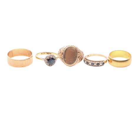 A collection of five rings; to include a sapphire and diamond cluster ring, testing as 18ct and marked 'plat', ring size N 1/