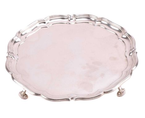 A 20th-century silver salver, by George Howson (Harrison Brothers &amp; Howson), Sheffield 1933, with piecrust edge and suppo