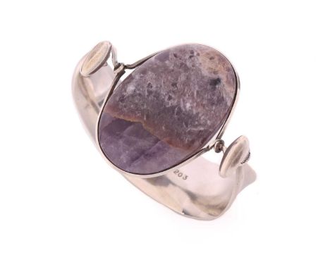 Georg Jensen - 'Arm Ring' with amethyst, a tension clamp opening bangle with an oval panel of an opaque amethyst set in a rin