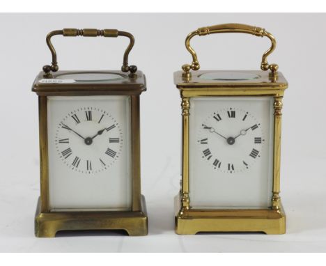 An early 20th Century carriage clock, brass cased with bevel edged glass panels, white enamel dial with Roman numerals, 8 day