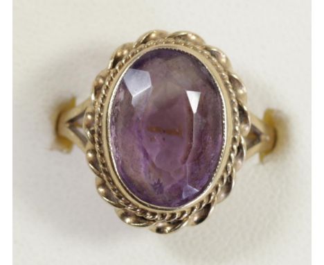 A 9ct gold and amethyst single stone ring, 14 x 10mm, O, 4.3gm 