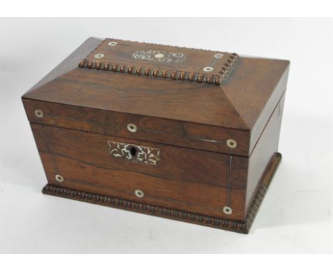 A Victorian rosewood tea caddy of sarcophagus form, with mother of pearl and beaded decoration, hinged lid opening to reveal 