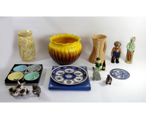 A collection of ceramics to include, a boxed set of Wade Guinness advertising dishes, Goebel models of rabbits, Royal Doulton