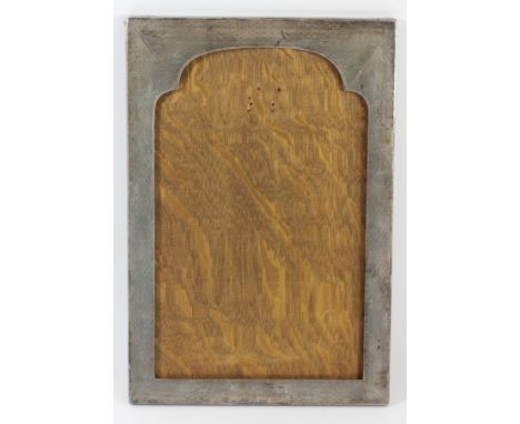 A large silver photograph frame, Birmingham 1929, with engine turned arched decoration, lacking easel back, 30 x 20cm 
