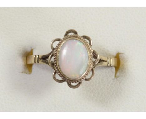 A 9ct gold and collet set opal single stone ring, N, 2.3gm 