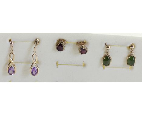 A 9ct gold pair of amethyst ear studs, a nephrite jade pair and a garnet pair, 2.4gm 