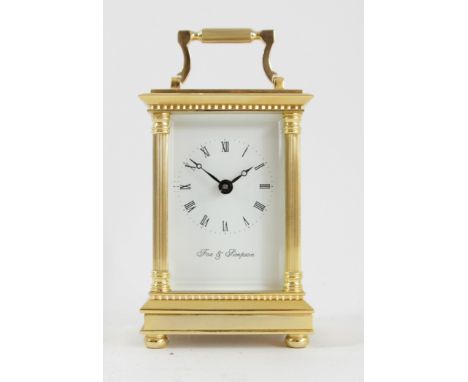 Fox &amp; Simpson, a gilt brass Anglais Riche cased carriage time piece, the white enamel dial with Roman numerals, the movem