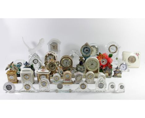 A collection of cut-glass/crystal mantle and bedside clocks, makers to include - Waterford, Edinburgh Crystal, Killarney of I