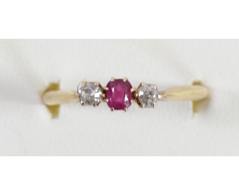 An 18ct gold ruby and diamond three stone ring, Birmingham 1939, R, 2.1gm 