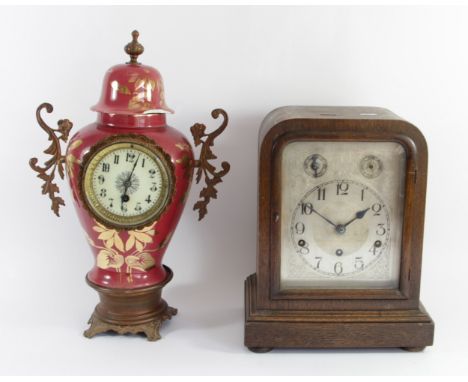 An early 20th Century oak cased bracket clock, 8 day movement (unsigned) striking to gong, together with a French porcelain m