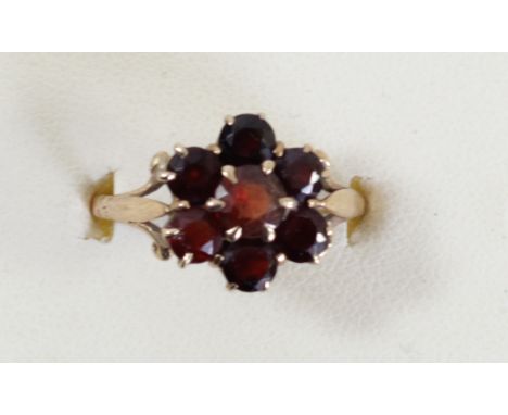 A 9ct gold and garnet cluster ring, O, 2.5gm 