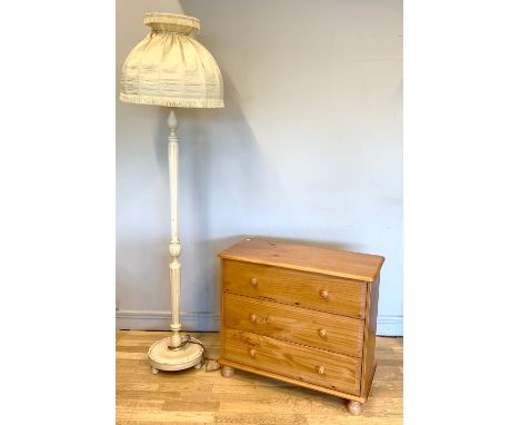A pine chest of three drawers, bun handles on raised feet, 85x74x39cm, together with painted turned wood standard lamp & shad