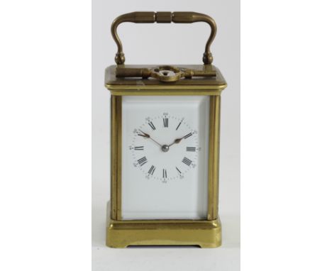 A late 19th century French Corniche cased brass striking and repeating carriage clock, white enamel dial with Roman numerals,
