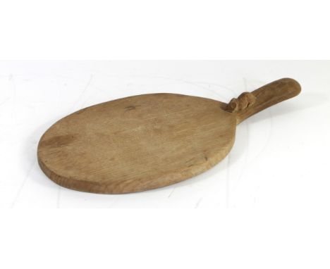 Robert 'Mouseman' Thompson carved oak cheeseboard, of oval form with carved mouse figure to handle, length 38cm. 