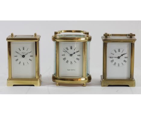 An English Angelus brass cased 8 day carriage clock, together with a 'Mappin &amp; Webb' oval shaped 8 day carriage clock and