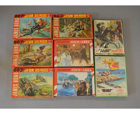 Eight James Bond jigsaw puzzles: HG Toys Jaws; HG Toys 3; two Hestair A View To a Kill (different pictures, both sealed); fou