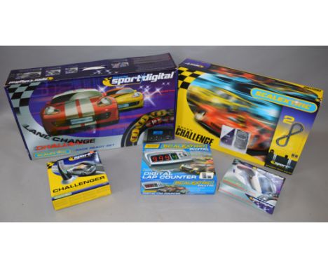 3 Scalextric Sport and Sport Digital Sets together with various boxed accessories including Track extensions, Challenger, Con