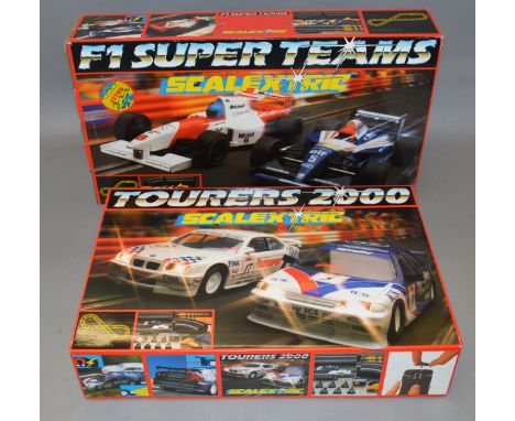 4 x Scalextric Sets: Tourers 2000; Escort Rally, F1 Super Teams; Le Mans 24Hr