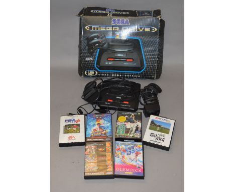 Sega Megadrive II together with a Light Fantastic Commodore 64, both boxed.