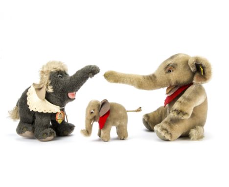 Three post-war Steiff elephants, Walt Disney’s Jungle Book Baby Hathi with bib and chest tag; a seated Soft Elephant Jumbo wi