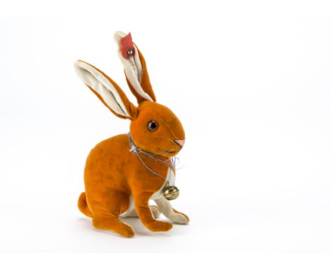 A rare Steiff orange velvet Rabbit, 1927-1932, with brown and black glass eyes, pink stitched nose and black stitched mouth, 