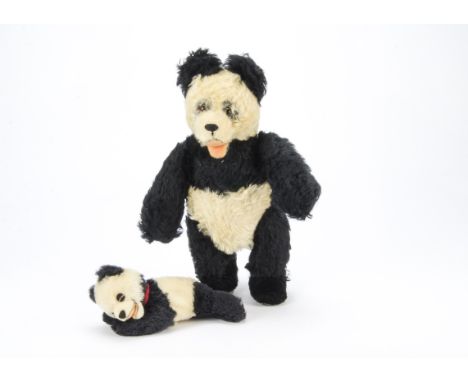 A post-war Steiff panda,  With black and white mohair, open felt mouth, swivel head and jointed limbs with grey suedette pads