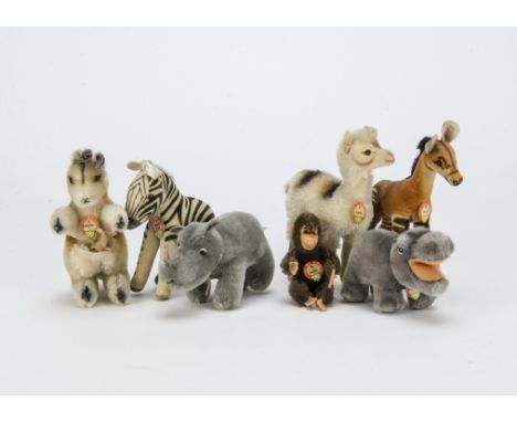 Seven post-war Steiff wild animals, Lama llama —6½in. (16.5cm.) high, okapi, velvet zebra, Jocko monkey, Mockie hippopotamus,