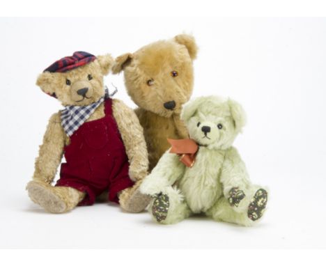 A post-war Chiltern Hugmee teddy bear, with blonde mohair, orange and black glass eyes, swivel head and jointed limbs with ve