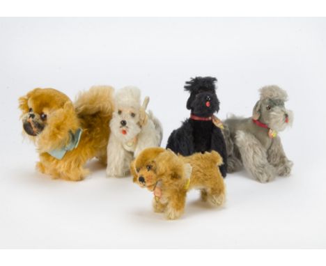 Five Steiff post-war dogs, A Peki pekinese —6in. (15cm.) long, a black, white and grey Snooby poodle and standing golden Cock