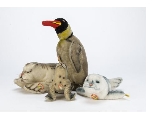 Steiff 1950s polar animals,  A Peggy penguin —13in. (33cm.) high, a smaller example, a Dralon Cosy Robby seal, a Floppy Robby
