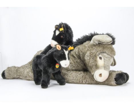 A large Steiff yellow tagged Molly Donkey, With button —39½in. (100cm.) long; and yellow tagged Fenny and Molly black ponies 