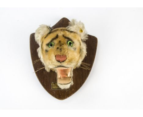 A rare post-war Steiff tiger hunting trophy head,  USA exclusive mounted on wooden shield with brass plaque ‘Edward December 