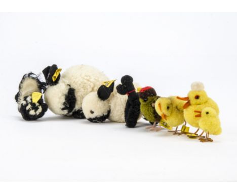 Eight post-war Steiff pom-pom animals, A Skunk, yellow Duck and Duckling with metal feet, black Poodle, two rabbits and two b