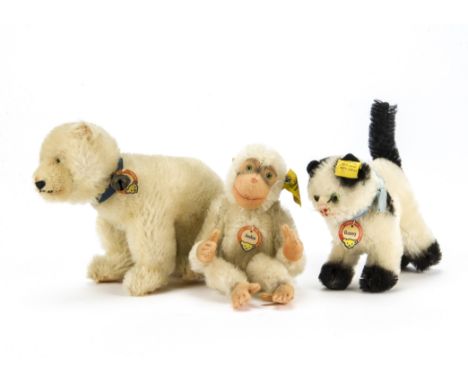 A post-war Steiff Polar Bear, With blue collar and tag —6½in. (15.5cm.) long (dusty); a white Jocko Monkey and white and blac