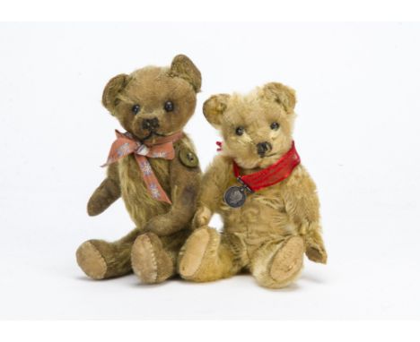 A small Farnell teddy bear 1910-1920s, With golden mohair, black boot button eyes, pronounced muzzle, black stitched nose and