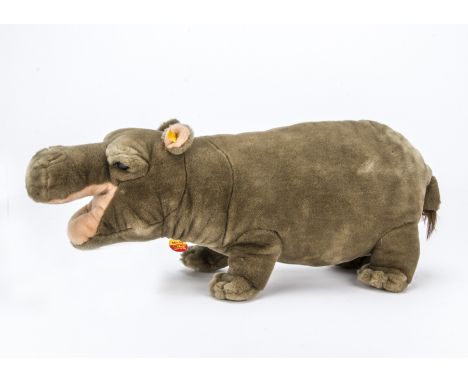 A Steiff modern yellow tagged Mocky Hippopotamus, Standing with button and chest tag —24½in. (62cm.) long